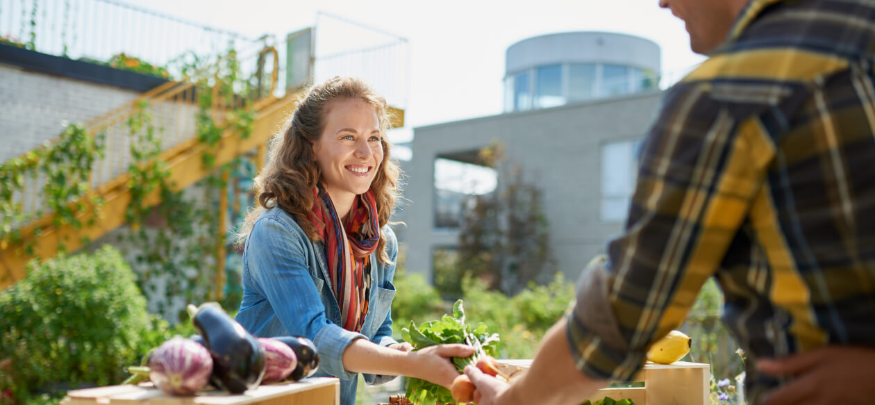 Women buy vegetables